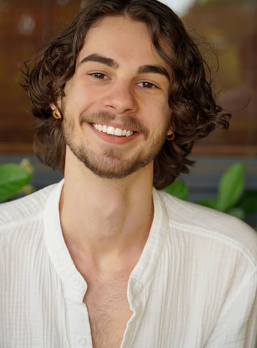 a man with a beard and a white shirt