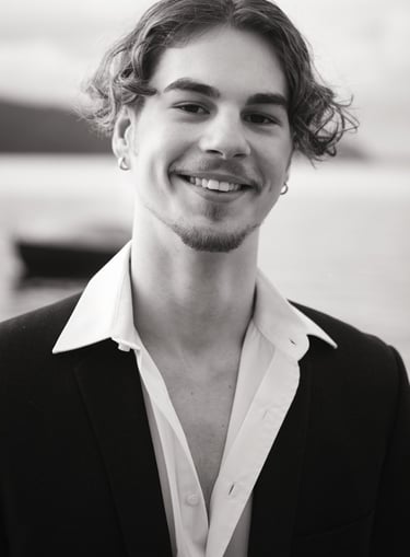 a man in a suit and white shirt