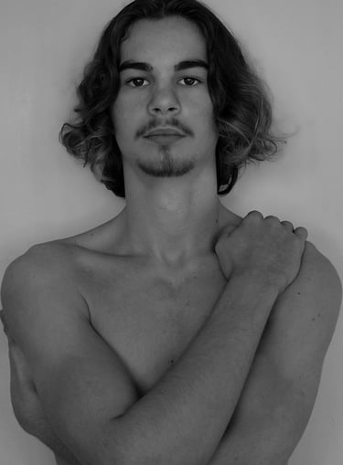 a man with a mustache and bare chest