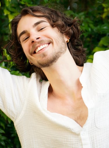 a man with a beard and a white shirt