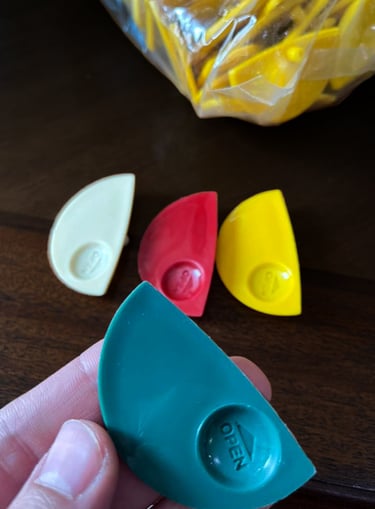 Injection molded disposable sauce containers in various colors, designed by Koorosh Shojaei, 2