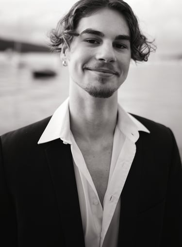a man in a suit and white shirt