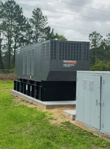 A 500kw Generac Industrial Generator installed on a platform next to the power station
