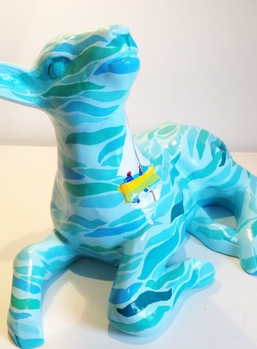 Small sculpture of a lamb featuring a Swallows and Amazons design by Laura Fearn