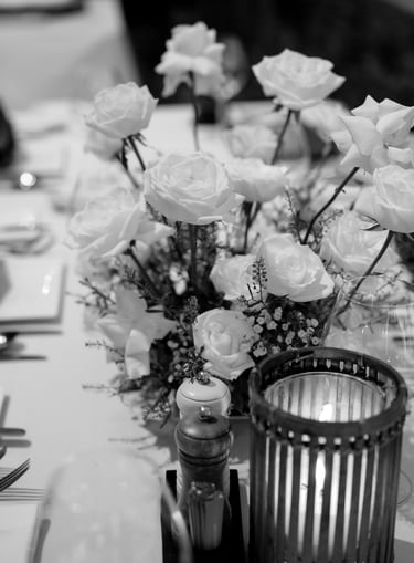 a table with a vase filled with flowers