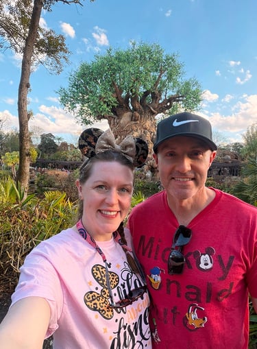 Aimee Cochrane and husband pictured at Disney's Animal Kingdom® inside Walt Disney World®.