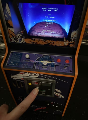 Numskull Space Invaders Inserting a Coin