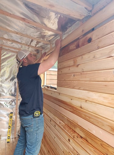 Logan working on cedar sauna