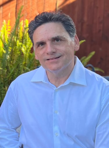 a man in a white shirt and a planter