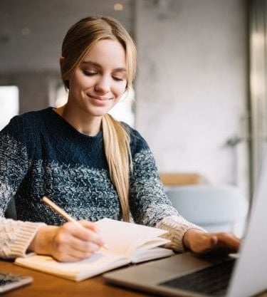 Teenager having online maths tutoring.