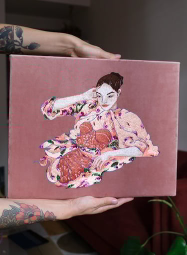 Embroidery of a fashion illustration with a women in pink dress