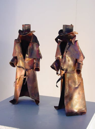two metal sculptures of bushrangers