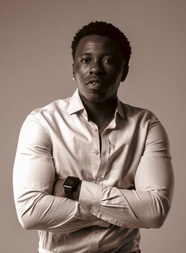 a man in a white shirt and a watch on his wrist
