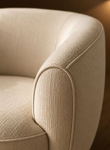 Curved upholstered chair arm detail