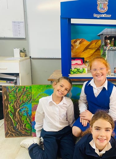 Children next to drama props