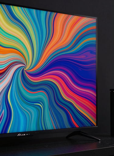 Vibrant close-up of a modern LG TV screen showing a colorful abstract fluid art video in a dark room