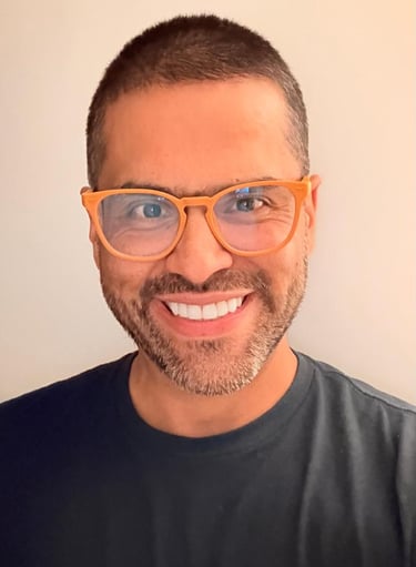 a man with glasses and a black shirt