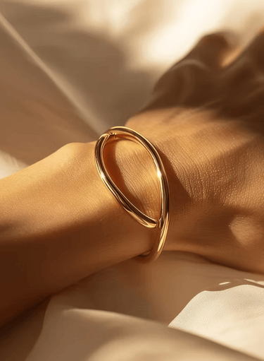 a woman's handmade gold - plated bracelet bracelet