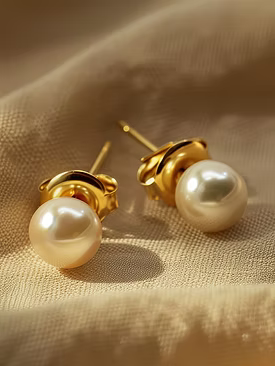 a pair of pearl earrings with pearls