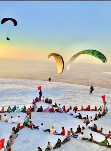 Children exploring the vibrant streets of Morocco, with paragliding pilots soaring above