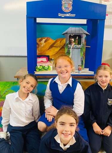 Children next to drama props