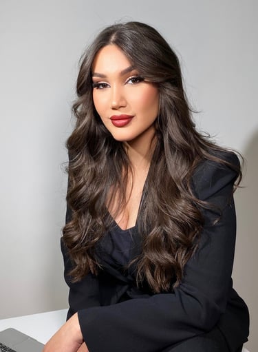 a woman with long hair and a laptop
