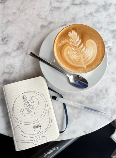 a cup of coffee with a drawing of the coffee cup
