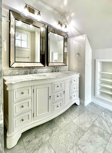 Bathroom with traditional architectural style, beautiful radius wood vanity, and marble countertops.