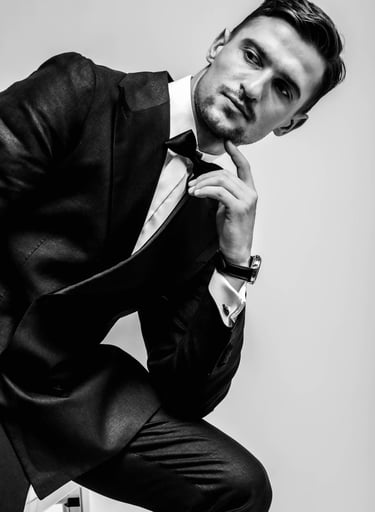 a man in a suit and tie is posing for a picture