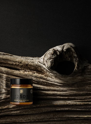 Product photography - a jar of honey on a branch