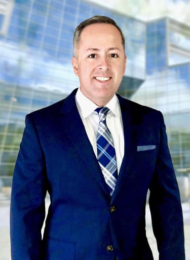 a man in a suit and tie smiling