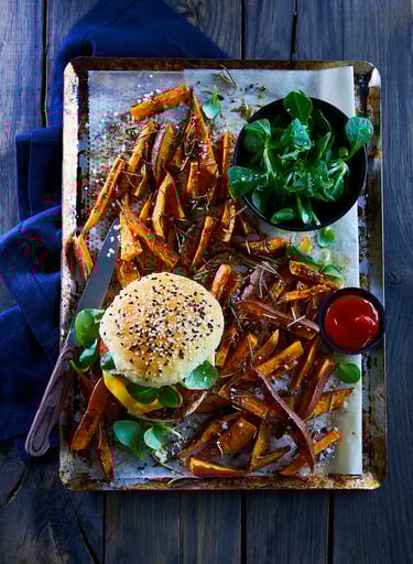 a tray of food on a tray with a knife and fork