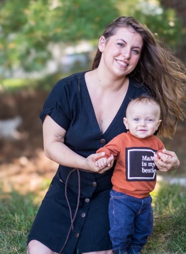 a woman holding a child in her arms