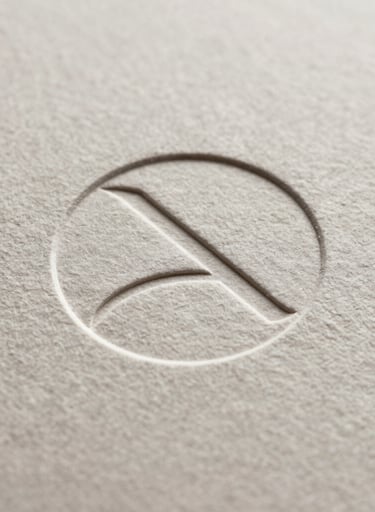 A macro, close-up shot of a minimalist logo embossed on textured off-white paper, focusing on the sophisticated finish and clean lines.