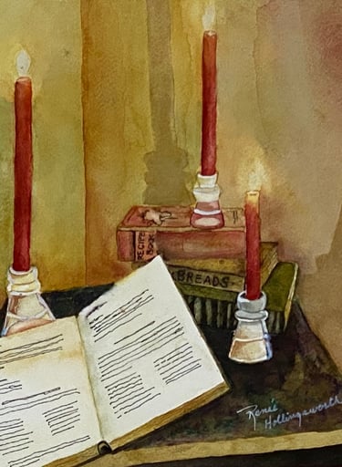 Reading a book by red candlelight with soft shadows against a wall of textured gold and ochre