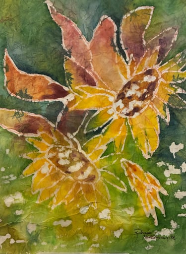 Blossoms in golden glory and centers of rust on a deep green background on handmade paper