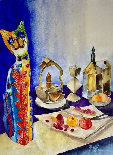 Cat sculpture adorned in red, blue, yellow and green on a table with metallic geometric forms