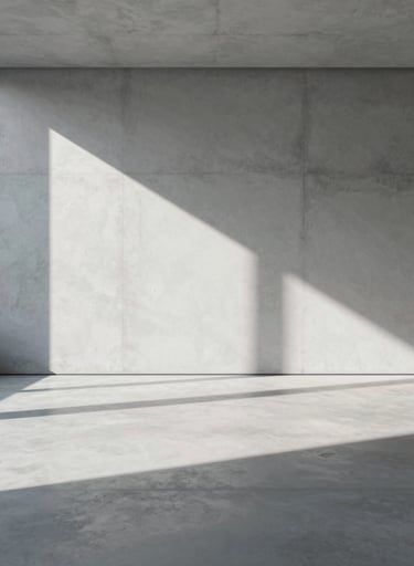 A sophisticated photograph of a minimalist concrete interior with dramatic sunlight casting long, sharp shadows. The composition is clean and centered, reflecting a premium production style with tones of #F2F5F7 and #8C9CA6.