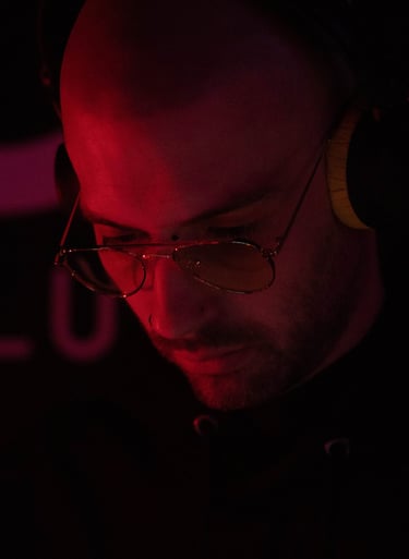 a man in a black shirt and headphones