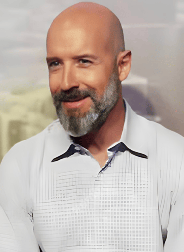 a bald balding man with a beard and a white shirt martin pe coach