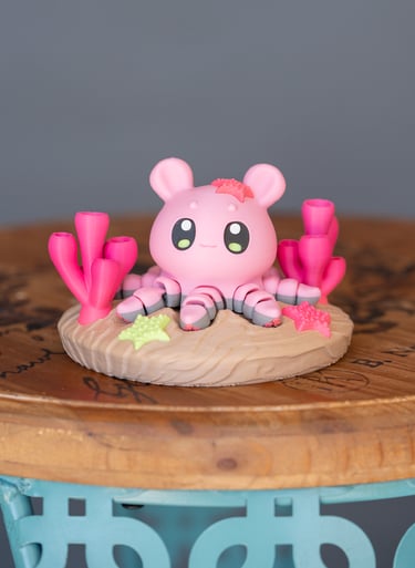 image of 3d printed pink octopus on a display circle