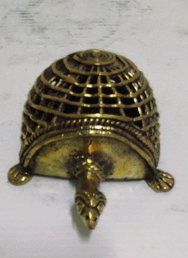 "Handcrafted brass tortoise with mesh-style carving on back–top view-for global shipment"