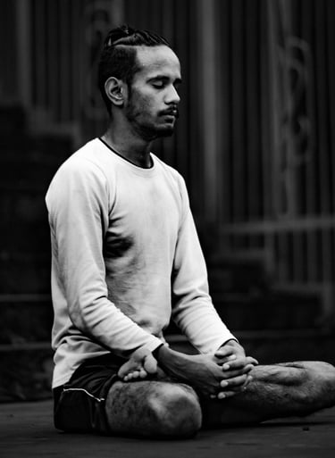 A man meditates in lotus pose