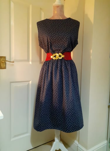 Black dress complete with red belt