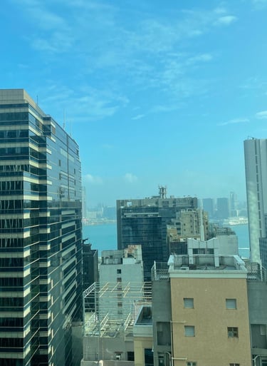 a city view of a city with a blue sky