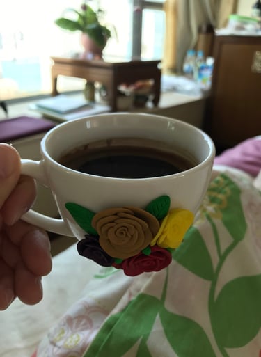  holding a cup of coffee