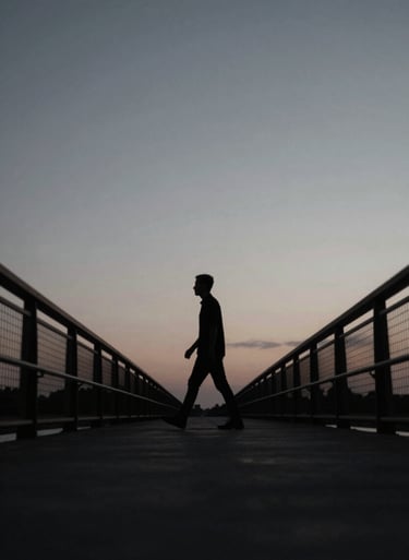 A silhouette of a man walking across a bridge at twilight, #0F0F0F shadows against a #A8A8A8 sky, cinematic wide shot, professional film production quality.