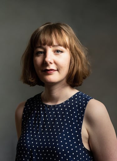 a woman with a blue dress and a white polka dot dot dot dot dot dot