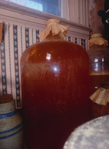 a large jug of fermenting cider