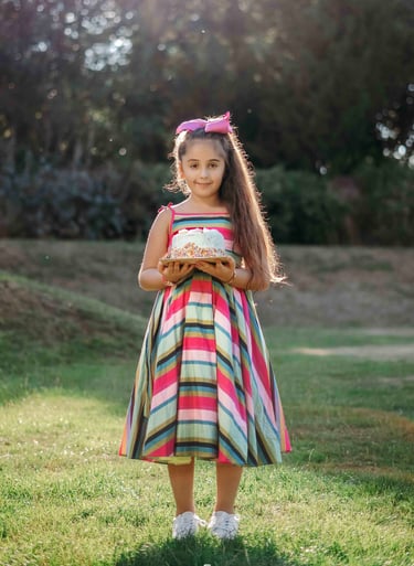 Girl in colorful striped dress posing outdoors – Fred Art Studio session